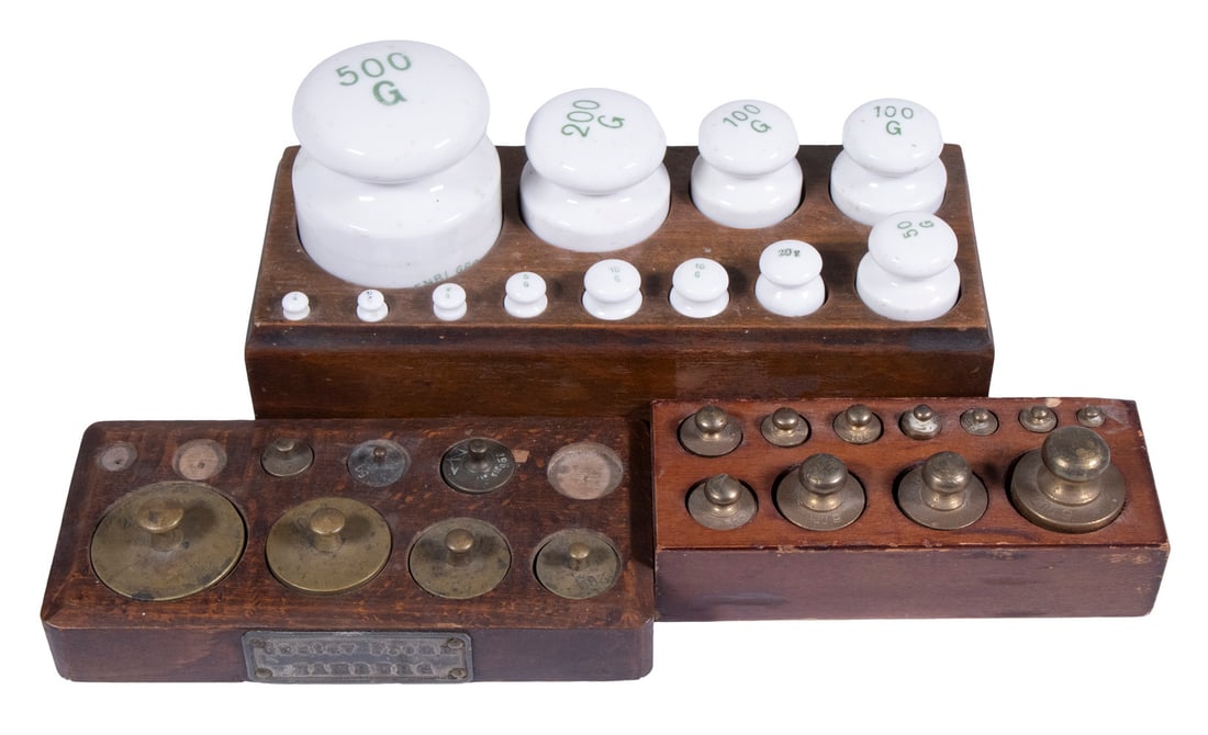 (3) SETS OF APOTHECARY WEIGHTS: (3) SETS OF APOTHECARY WEIGHTS All in fitted wooden blocks, incl: Early 20th c. set of (12) pottery weights, 500-g to 1-g., 4 1/2" high, 8 1/4" x 3 1/4"; Vintage (11) piece set of brass weights,