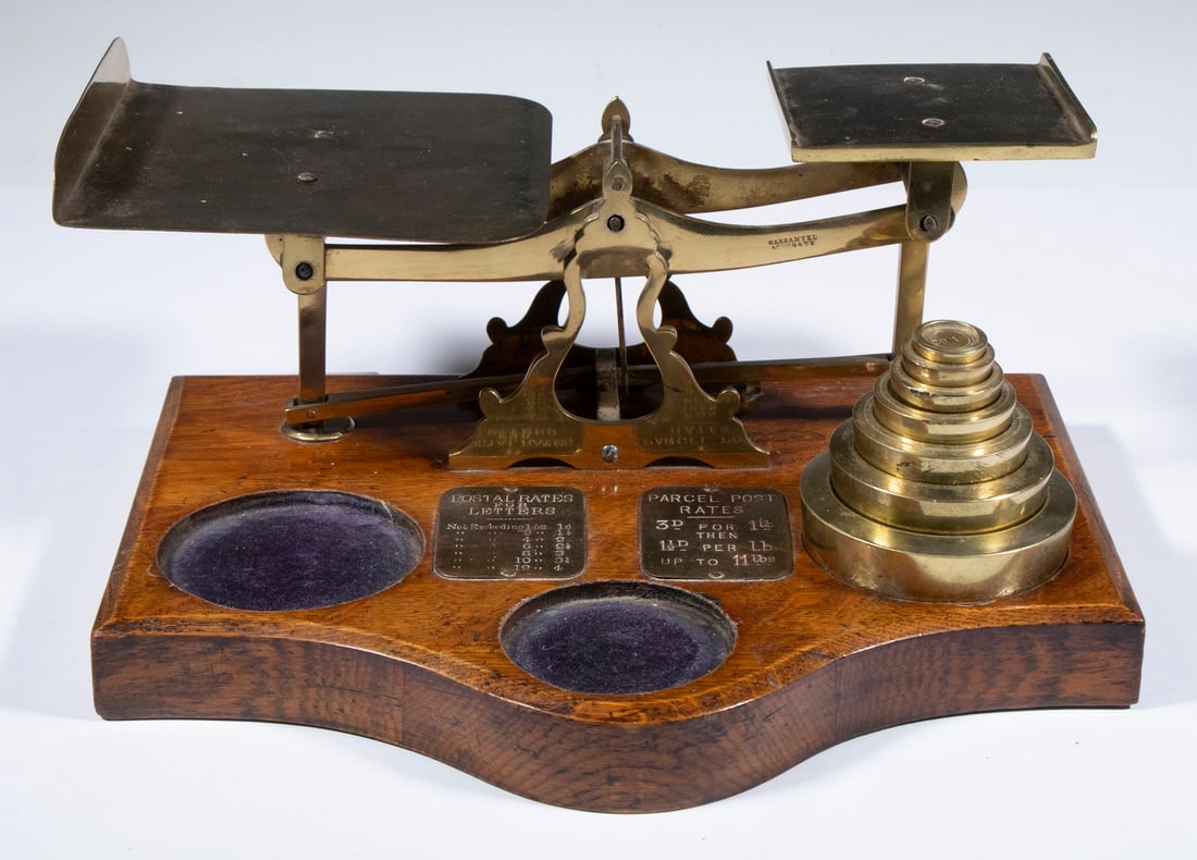 ENGLISH BRASS & OAK POSTAL SCALE: ENGLISH BRASS & OAK POSTAL SCALE Large Brass Tabletop Scale, ca. 1900, for letters and parcels, with heavy oak base. OS: 7 x 14 3/4 x 11 1/2 in. (17.8 x 37.5 x 29.2 cm.)