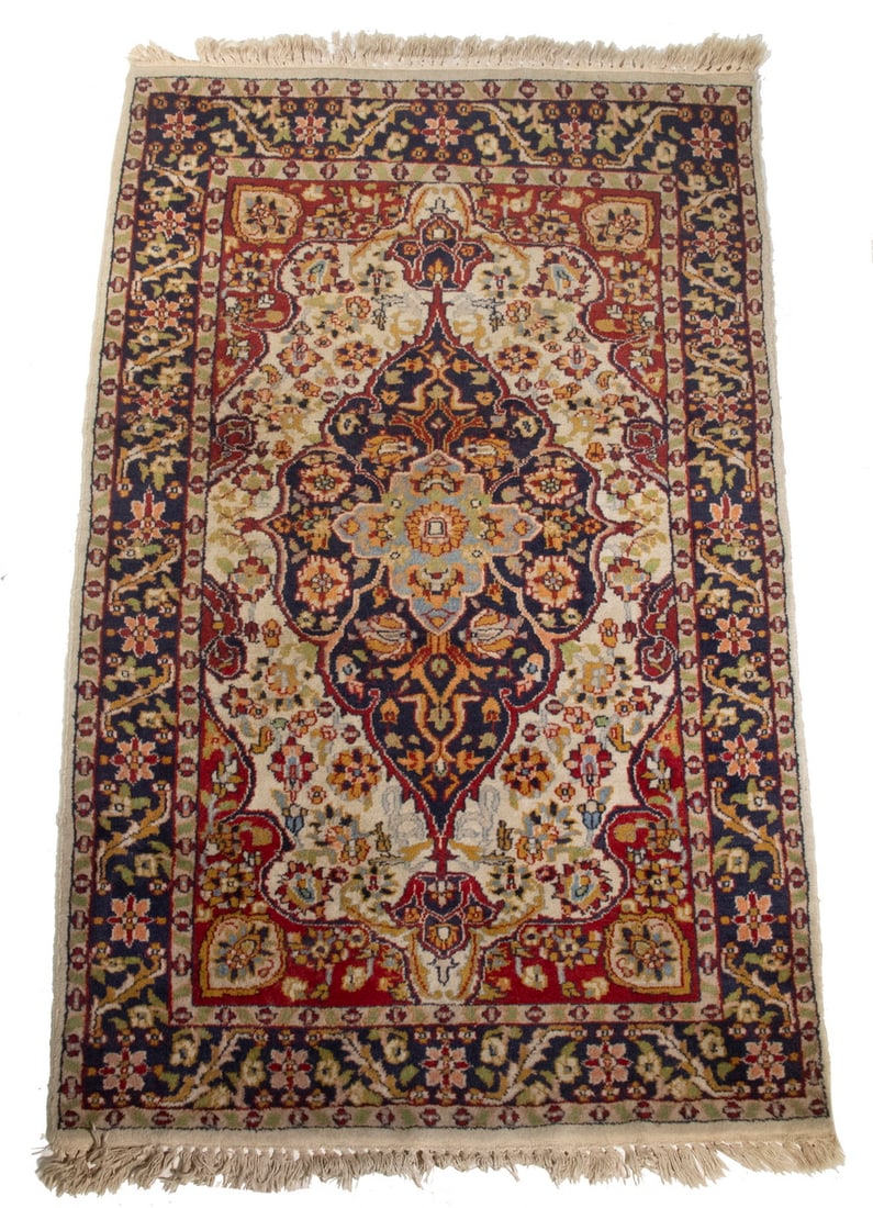 KASHAN STYLE RUG: KASHAN STYLE RUG (3' x 5') Midnight blue lobed oval medallion with "anchor" pendants, red spandrels surrounded by palmettes and rosettes in midnight blue, gray and red on the ivory field, midnight