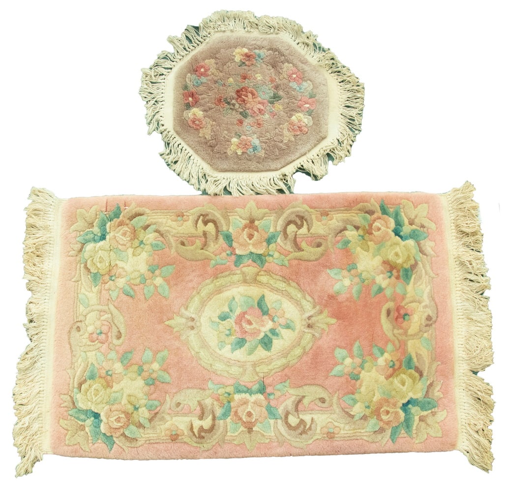 (2) MODERN CHINESE 'SCULPTED' RUGS: (2) MODERN CHINESE "SCULPTED" RUGS One with a rose field, gold medallion, floral border. The other an octagonal mat in apricot and rose. Both good condition. LGST: 24 x 36 in. (61 x 91.4 cm.), SMST: