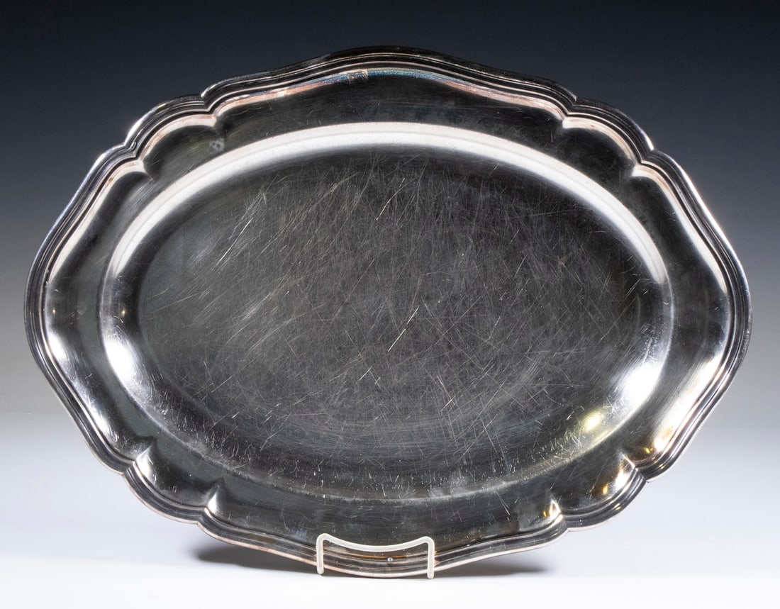 ENGLISH VICTORIAN SILVER-PLATE SERVING PLATTER: ENGLISH VICTORIAN SILVER-PLATE SERVING PLATTER Late 19th c. Oval Tray, by Hawksworth, Eyre & Co., with shaped rim, stamped with orb and cross maker's mark and "Made in England" on the base. Surface