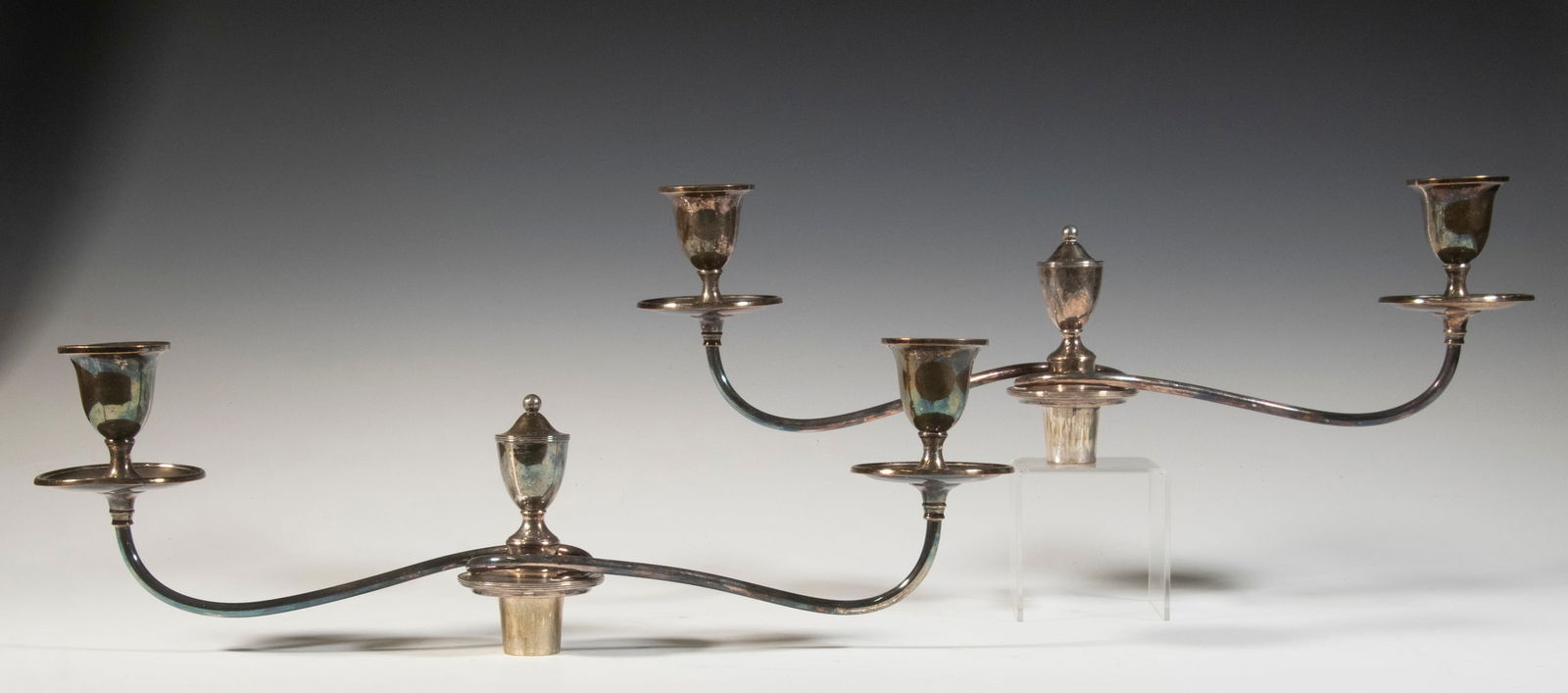 EXTENSION SILVERPLATE CANDLE STICK HOLDERS W/ ACCESSORIES: EXTENSION SILVERPLATE CANDLE STICK HOLDERS W/ ACCESSORIESLot of two silver double candle stick holders without bases. Lot includes group of glass wax shields in cloth bag and two silver base feet.