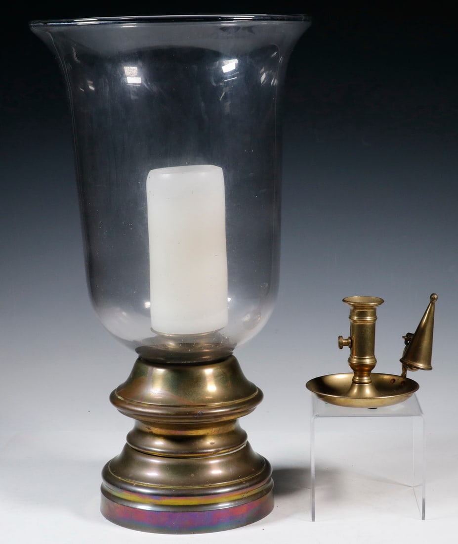 (2) BRASS CANDLE HOLDERS: (2) BRASS CANDLE HOLDERS (2) Piece Lighting Lot, incl: Large brass based pricket form candle holder with heavy glass hurricane shade, felted base. Good condition. LGST Height: 18 1/4 in. (46.4 cm.),