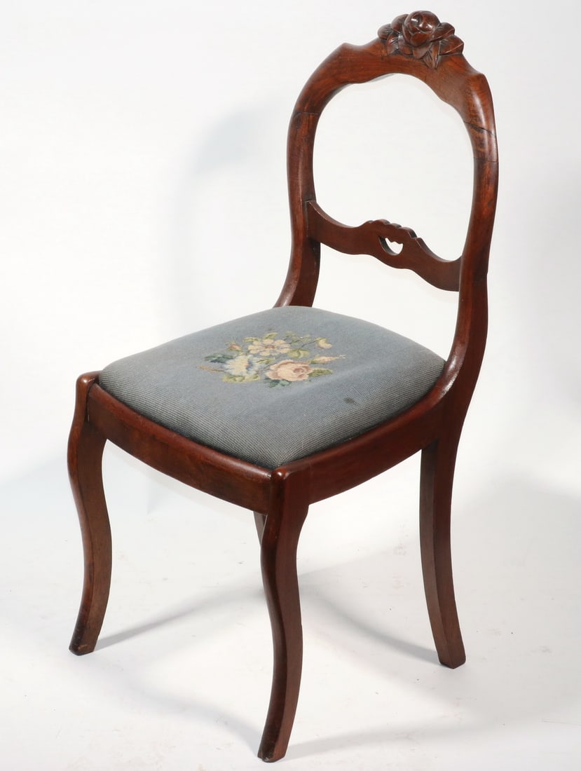 VICTORIAN SIDE CHAIR WITH NEEDLEPOINT SEAT: VICTORIAN SIDE CHAIR WITH NEEDLEPOINT SEAT 19th c. Balloon Back Walnut Side Chair, with blue floral drop-in needlepoint seat, floral carved crest and open back, set on sabre legs. 17" high seat. Two