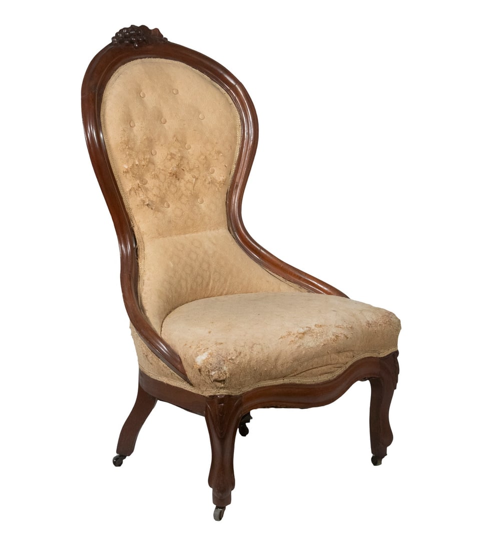 VICTORIAN PARLOR CHAIR: VICTORIAN PARLOR CHAIR American Late 19th c. Walnut Framed Chair, with curved frame and carved grape cluster design crest, upholstered seat and button tufted back, shaped front, set on carved legs