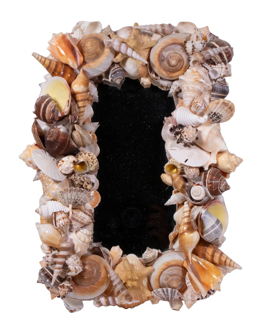 SEASHELL ENCRUSTED MIRROR: SEASHELL ENCRUSTED MIRROR Modern Rectangular Wall Mirror, the frame consisting of a large selection of artfully organized seashells. OS: 17 1/2 x 12 1/2 in. (44.5 x 31.8 cm.)