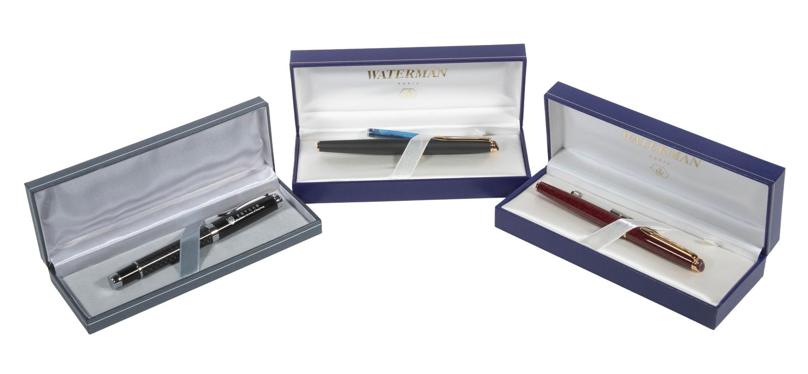 (3) CASED FOUNTAIN PENS, INCL. WATERMAN: (3) CASED FOUNTAIN PENS, INCL. WATERMAN Group of (3) Fine Writing Instruments, in original hinged presentation box, incl: (2) by Waterman, one in black and the other in red, 5 1/4" long; and (1) Pen