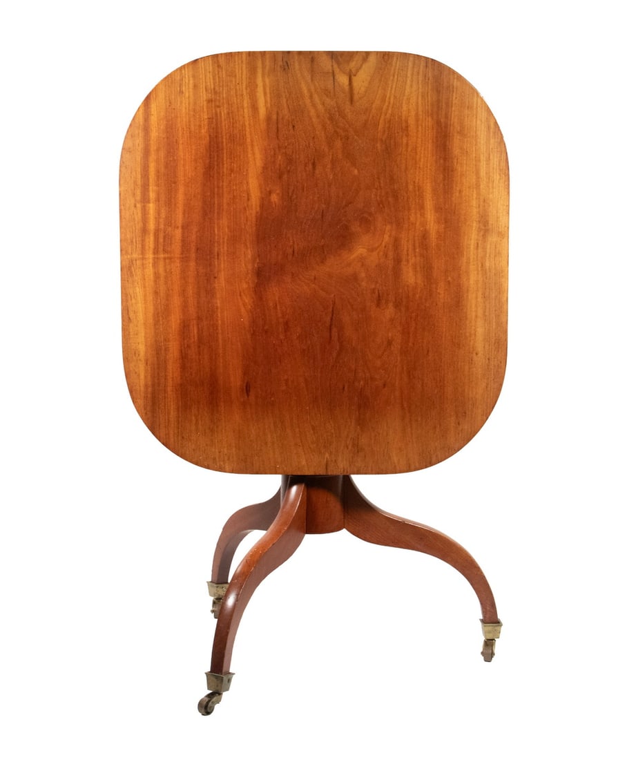 CHERRY TILT TOP TABLE: CHERRY TILT TOP TABLE Hepplewhite Style Table, with square top, vasiform turned pedestal, set on a tripod base with brass casters, 36 1/2" high tilted up. Size: 24 x 22 1/2 x 24 1/2 in. (61 x 57.2 x