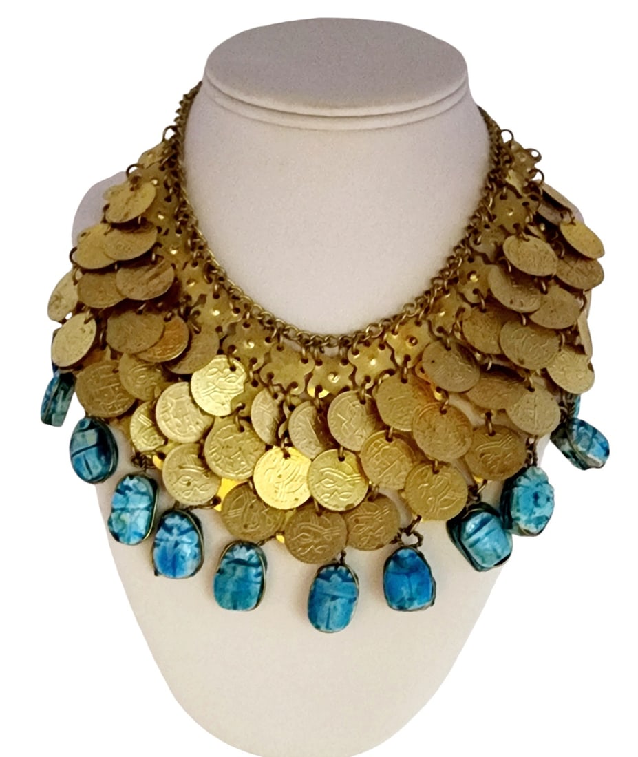Vintage Egyptian revival scarab coin bib necklace: Scarabs are made of glaze polymer clay, coins are woven unto brass backing, well made, 17" with an additional 3" drop down. WE OFFER IN-HOUSE SHIPPING AS WELL AS LIVE SHIPPING !! If you would like us 