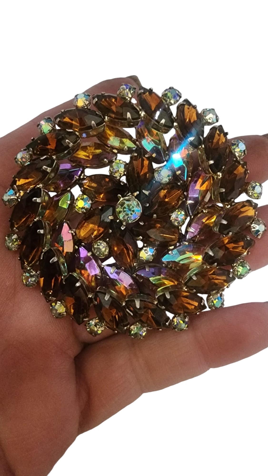 Unsigned spectacular layered pinwheel style rhinestone brooch: "2.5"", has ab purplish stones inside, rust color stones in the center and edges.Made very well, all prong set WE OFFER IN-HOUSE SHIPPING AS WELL AS LIVE SHIPPING !! If you would like us to ship your 