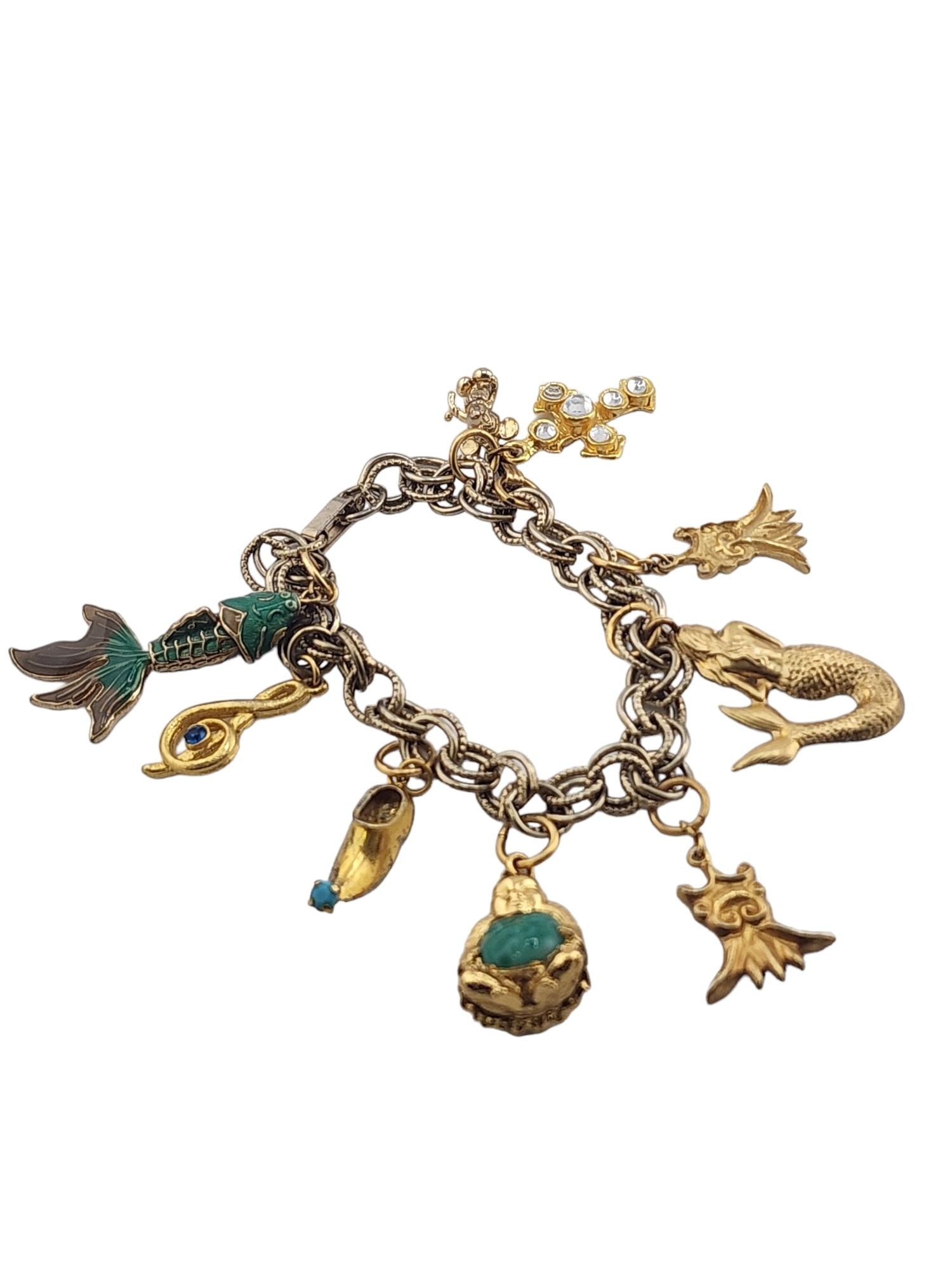 Vintage Charm Bracelet: Size: 8.25" Color: Gold Condition: Good vintage; some slight darkening to the chain Signed: None