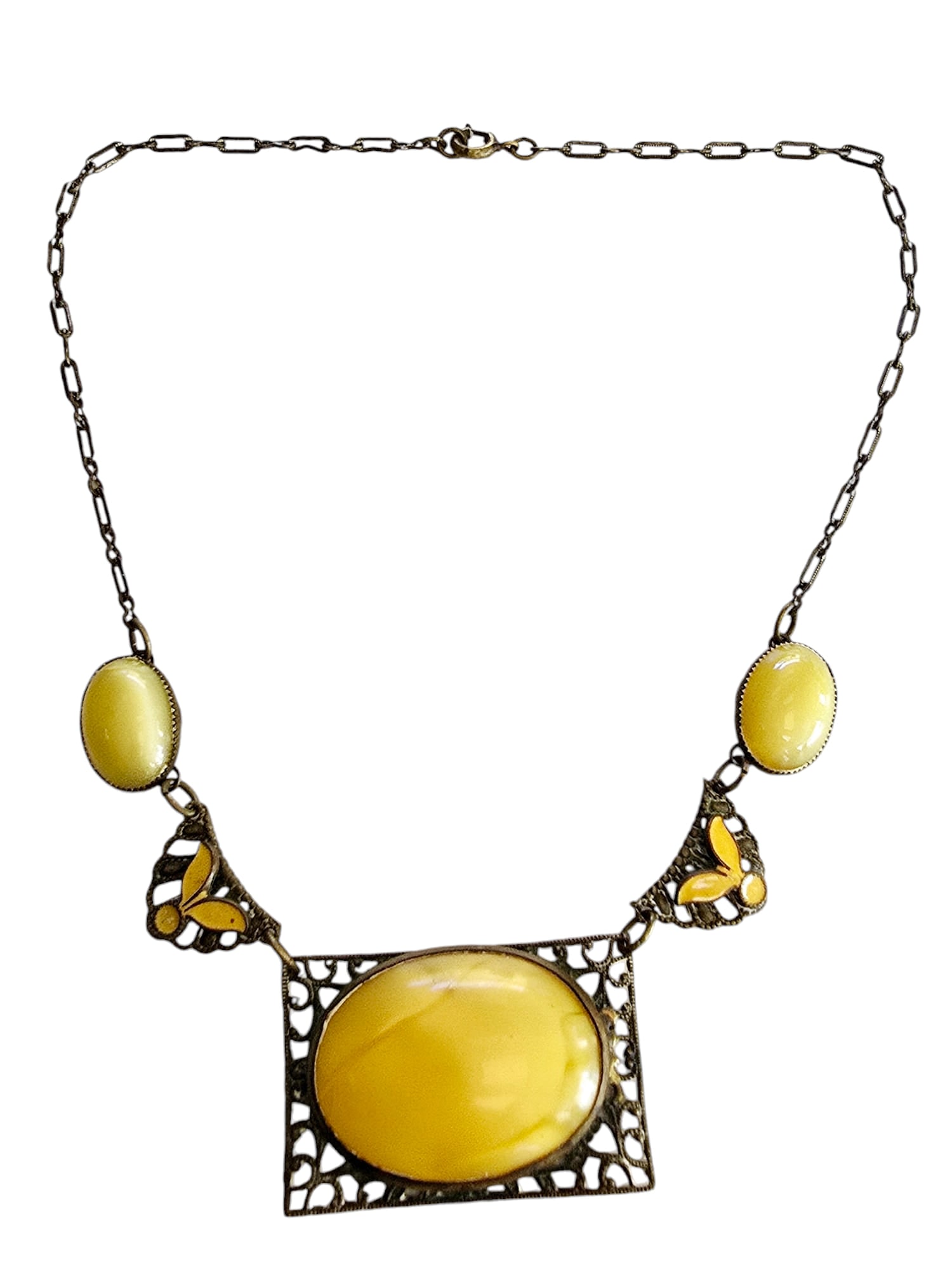 Unique Glowing yellow satin glass with leaf and dot Czech necklace: Yellow is getting much harder to find, attributed to Neiger, with the enamel leaf and dot design.All original, including the patina!The satin glass is gorgeous, center glass is bezel set, the smaller 