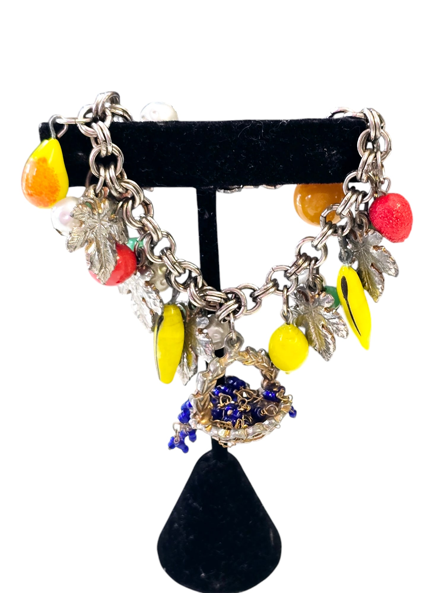 Vintage Fruit Glass Basket Charm Bracelet: 7", mostly glass fruit. In good vintage condition, there are some wear to metal. WE OFFER IN-HOUSE SHIPPING VIA UPS AS WELL AS LIVE SHIPPING AND LOCAL PICK UP!
