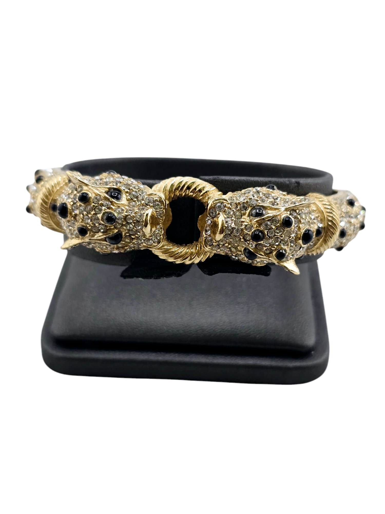 JEWEL ENCRUSTED CINER PANTHER BANGLE BRACELET: IN LIKE NEW CONDITION, HINGED, WITH SIDE CLOSURE, INNER DIAMETER 2.25". WE OFFER IN-HOUSE SHIPPING AS WELL AS LIVE SHIPPING AND LOCAL PICK UP! Please note: In-house shipping is not quoted on the aucti