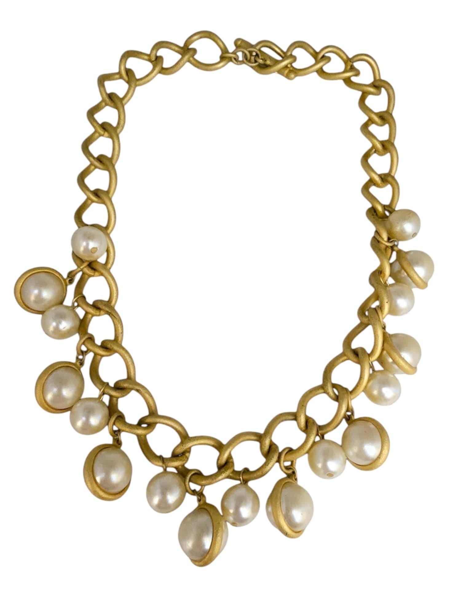 KENNETH LANE HEAVY MATTE GOLD DANGLING FAUX PEARL NECKLACE: NICE HEAVY MATTE GOLD. CHAIN, TOGGLE IS SIGNED, THE PEARLS ARE IN NICE CONDITION, 18". WE OFFER IN-HOUSE SHIPPING AS WELL AS LIVE SHIPPING AND LOCAL PICK UP! Please note: In-house shipping is not quot