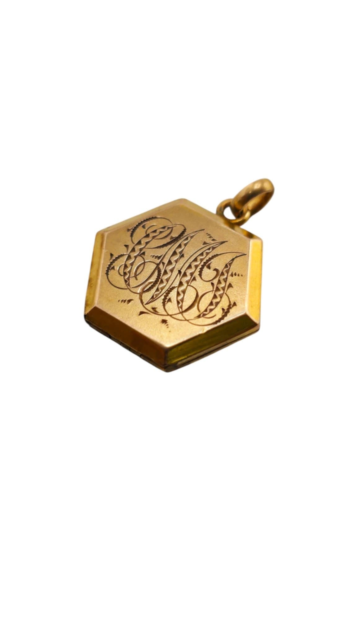 ANTIQUE ELABORATE INITIALED OCTAGON LOCKET WITH RELIGIOUS PLATE INSIDE: ANTIQUE ELABORATE INITIALED OCTAGON LOCKET WITH RELIGIOUS PLATE INSIDE, 1". IN VERY GOOD CONDITION, BEAUTIFUL FANCY INITIALING. WE OFFER IN-HOUSE SHIPPING AS WELL AS LIVE SHIPPING AND LOCAL PICK UP! P