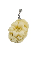 ANTIQUE MOLDED CELLULOID CHARM WITH ANTIQUE PHOTO ON THE BACK