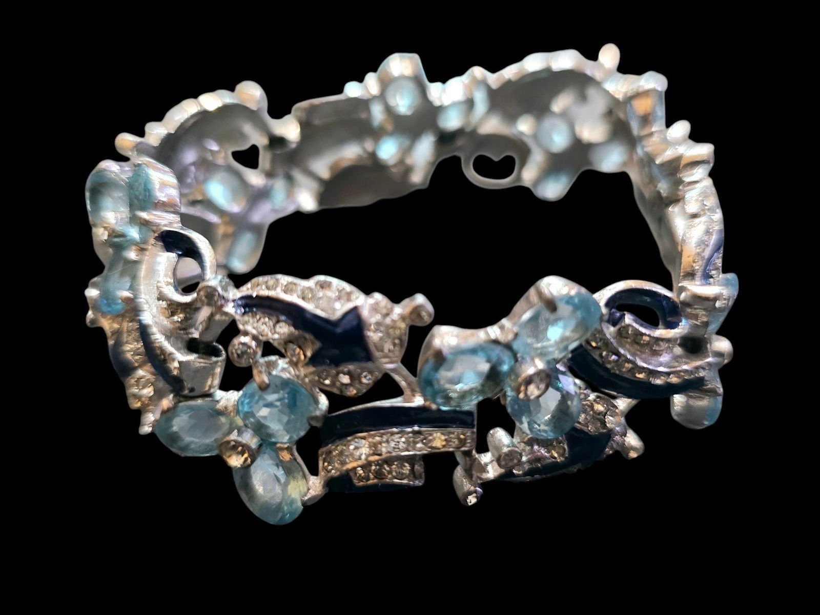 EXQUISITE RHODIUM PLATED1930S BLUE ENAMEL PAVE AND TRILLIUM FLOWER BRACELET ATTRIBUTED TO MAZER: EXQUISITE RHODIUM PLATED1930S BLUE ENAMEL PAVE AND TRILLIUM FLOWER BRACELET ATTRIBUTED TO MAZER, THIS BRACELET IS JUST OVER THE TOP. ALMOST POSITIVE IT'S AN UNSIGNED MAZER.I HAVE ATTACHED IN THE COMME