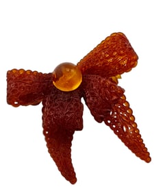 VINTAGE EARLY PLASTIC DIMENSIONAL BOW BROOCH