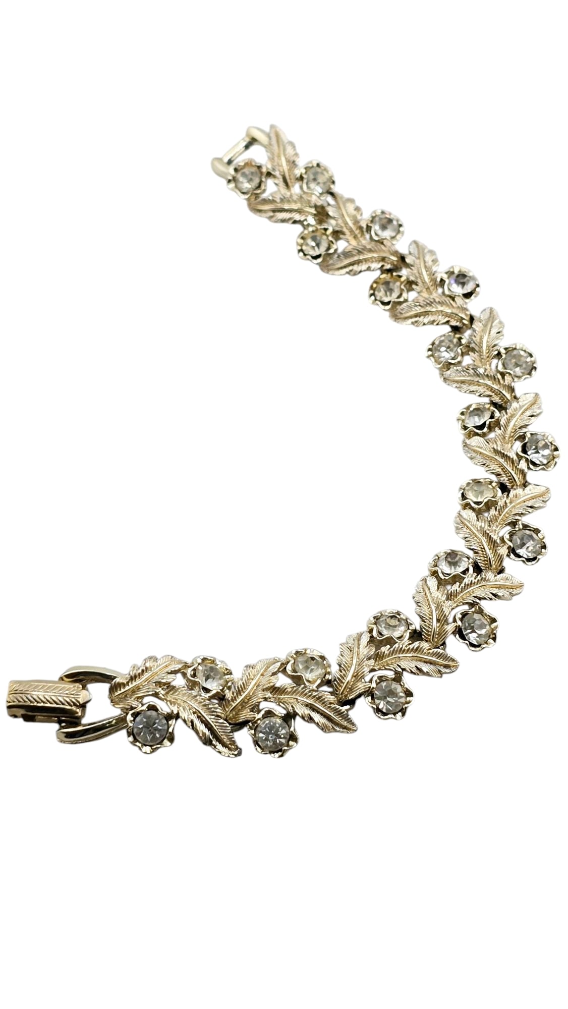 VINTAGE CORO RHINESTONE AND LEAF BRACELET: VINTAGE CORO RHINESTONE AND LEAF BRACELET, 7". IN VERY GOOD CONDITION, SIGNED! WE OFFER IN-HOUSE SHIPPING AS WELL AS LIVE SHIPPING AND LOCAL PICK UP! Please note: In-house shipping is not quoted on th