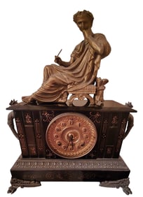 ELABORATE BLACK IRON ANSTONIA MANTLE CLOCK WITH GILT FACE AND GARGOYLE HANDLES AND LADY CLOCK TOPPER
