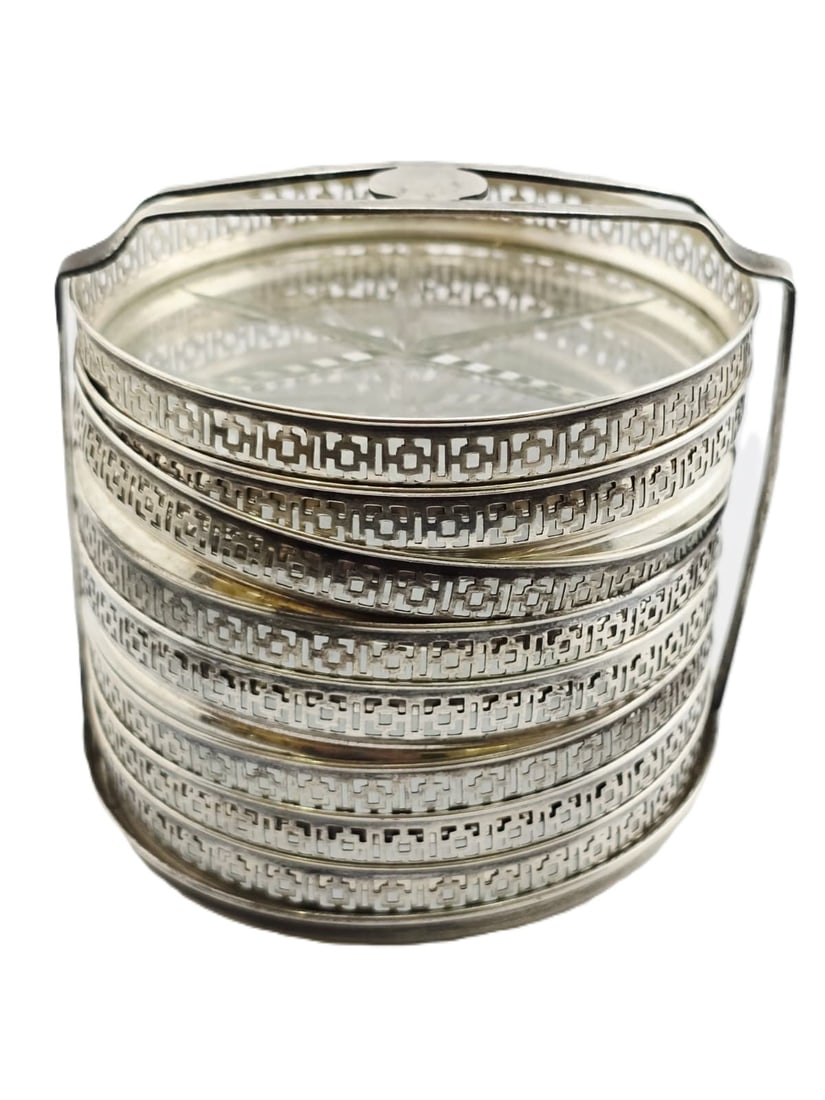 VINTAGE STERLING & GLASS PIERCED COASTER SET OF 8 WITH HOLDER: VINTAGE STERLING & GLASS PIERCED COASTER SET OF 8 WITH HOLDER. WHOLE SET WITH HOLDER 2.75" HIGH. COASTERS ARE 3" x .25" HIGH. WEIGHS WITH GLASS INCLUDED 287.39 GRAMS. IN VERY GOOD CONDITION, A FEW EDG