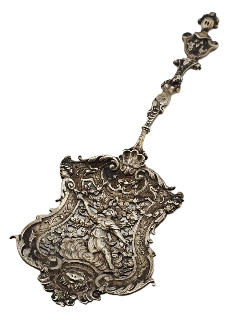 ANTIQUE 800 SILVER OR HIGHER ELABORATE DUTCH CHERUB SERVING PIERCED: ANTIQUE 800 SILVER OR HIGHER ELABORATE DUTCH CHERUB SERVING PIERCED. IN VERY GOOD CONDITION, LOTS OF GREAT DETAILING. TESTED WITH ACID HOLDS AS STERLING, BUT MIGHT BE 800 SILVER. AMAZING WORKMANSHIP. 