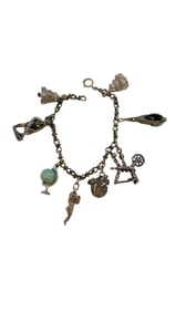 FABULOUS SILVERTONE CHARM BRACELET WITH A FEW STERLING CHARMS