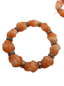 VINTAGE CORAL TONE RESIN BUDDHA BRACELET NOS