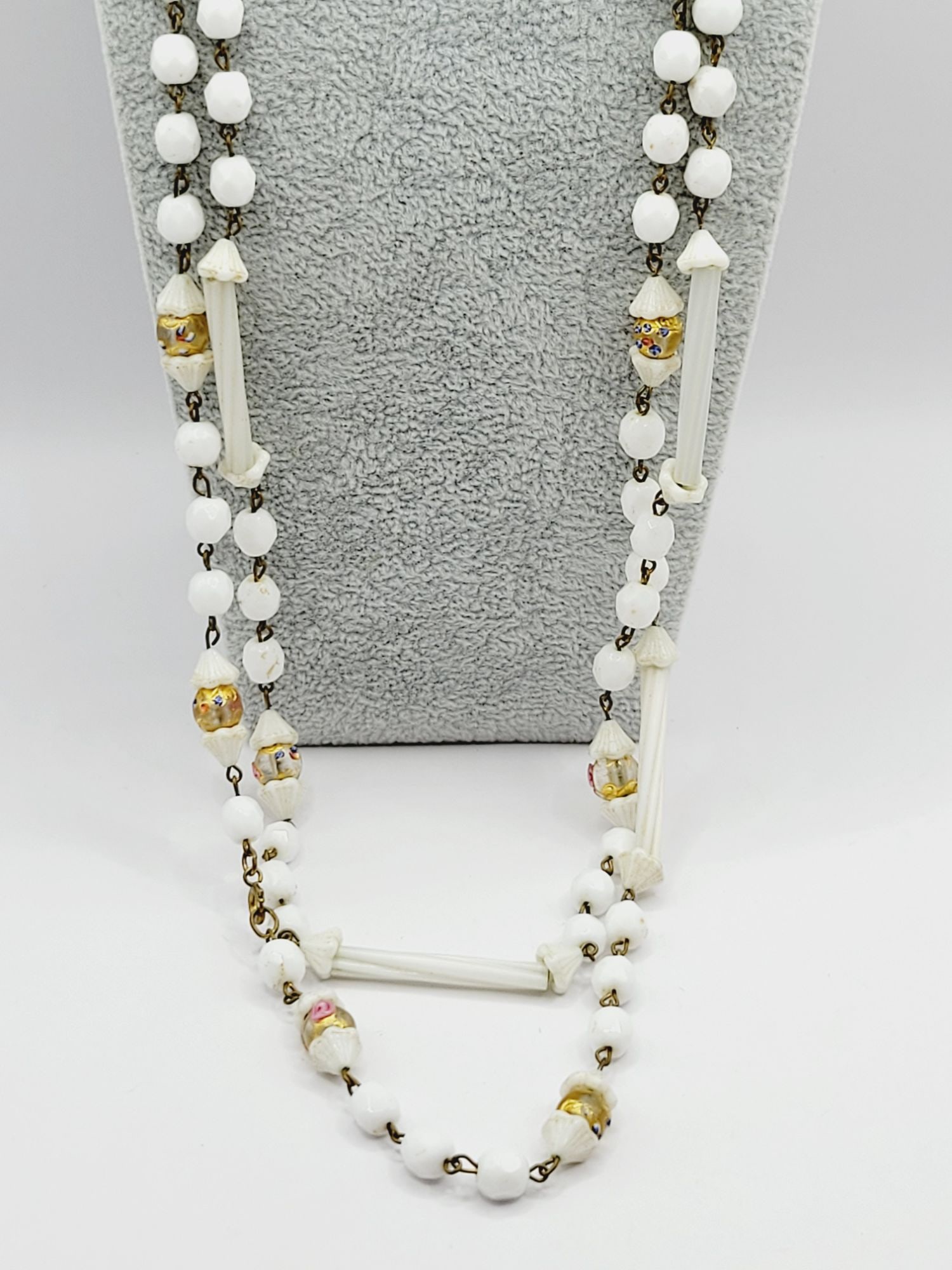 VINTAGE GLASS MILK & WEDDING CAKE BEADED NECKLACE: Vintage Glass Milk & Wedding Cake Beaded Necklace Vintage necklace made with round and tubes glass milk beads, adorned with gold wedding cake beads. Some of the milk glass tubes are not perfect. Size: