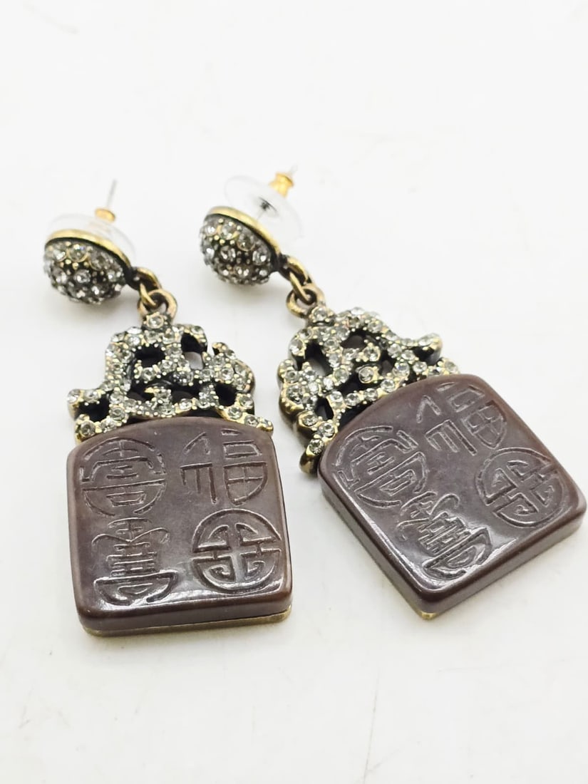 HEIDI DAUS RHINESTONE AND ETCHED ASIAN MOTIFF PIERCED EARRINGS: HEIDI DAUS RHINESTONE AND ETCHED ASIAN MOTIFF PIERCED EARRINGS. 2.25", IN VERY GOOD LIKE NEW CONDITION. SIGNED.