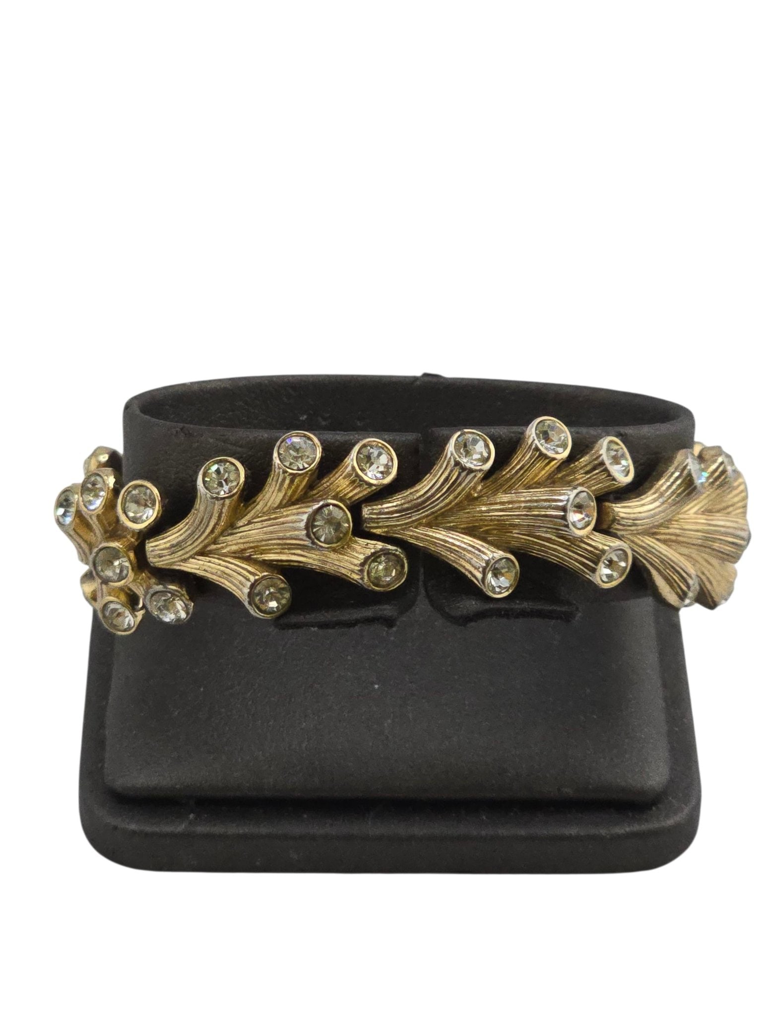 SIGNED CROWN TRIFARI TEXTURED BRANCH CORAL BRACELET WITH RHINESTONES: SIGNED CROWN TRIFARI TEXTURED BRANCH CORAL BRACELET WITH RHINESTONES. SIGNED ON THE FOLD OVER CLASP, THE BRACELET HAS GOOD WEIGHT TO IT. SOME WEAR TO THE BACK. BEAUTIFUL DESIGN AND PLATING IS GOOD TO