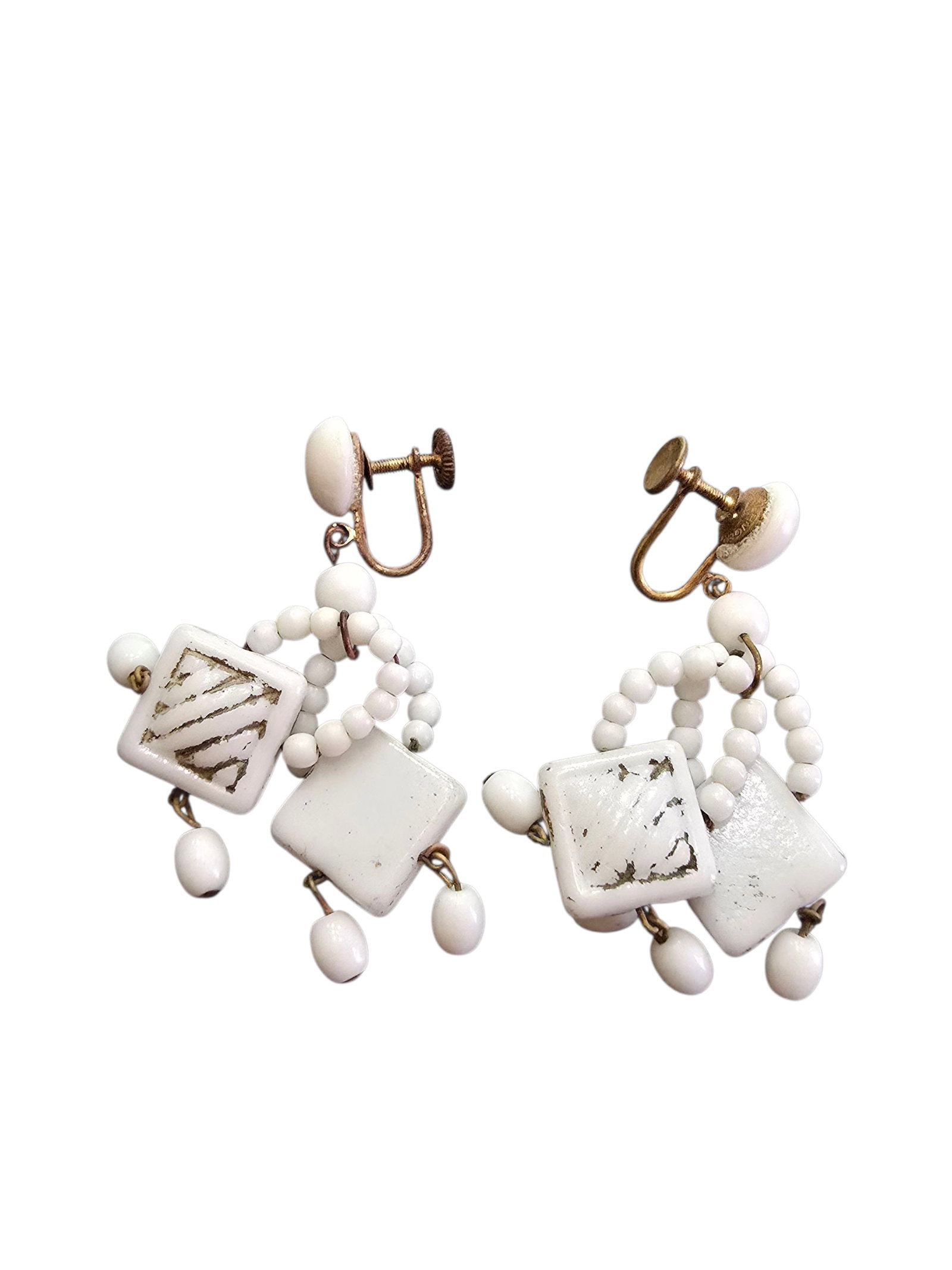 ANTIQUE CZECH MILK GLASS CUSTARD DANGLING CLIP EARRINGS: ANTIQUE CZECH MILK GLASS CUSTARD DANGLING CLIP EARRINGS. 2.25". IN VERY GOOD CONDITION, SOME OF THE DARK COLOR IS OF THE SQUARES.