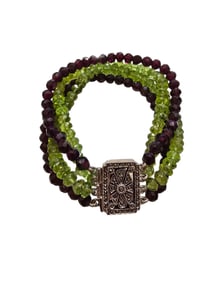 STUNNING STERLING AND 4 STRAND AMETHYST AND PERIDOT BRACELET WITH MARCASITE FANCY PUSH IN CLASP