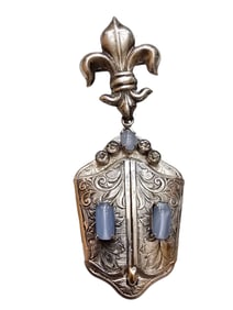 ANTIQUE UNUSUAL FLEUR-DE-LIS DANGLING EMBOSSED LOCKET WITH SATIN GLASS STONES.