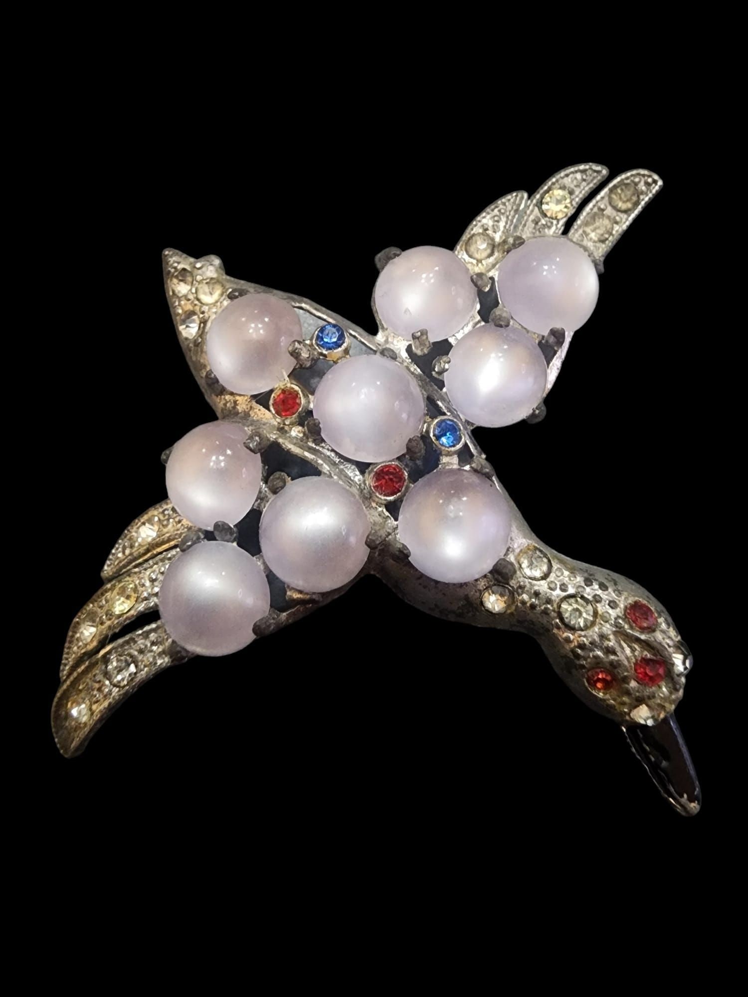 VINTAGE 40S POT METAL AND RESIN MOONSTONE BIRD BROOCH: Vintage 40s Pot Metal And Resin Moonstone Bird Brooch (A4876)Size: 2.75" x 3"Color: Silver, whiteCondition: Very good vintageEra: Circa 1940sSigned: NoneDetails: beautiful resin moonstone. A few stone