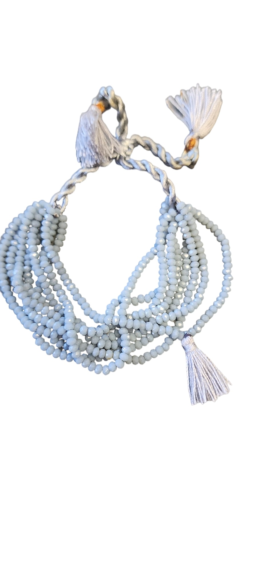 NOS VINTAGE 8 STRAND CRYSTAL AND SILK CORD ADJUSTABLE BRACELET: NOS Vintage 8 Strand Crystal And Silk Cord Adjustable Bracelet (A5125) Size: Can go up to 8.5" Color: White Condition: New old stock Signed: None