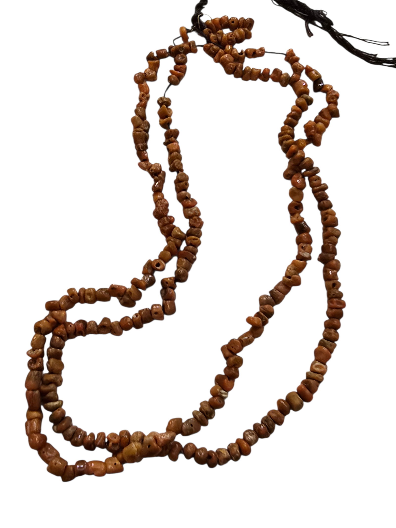 VINTAGE 2 STRANDS OF POLISHED SMALL BEADS POSSIBLY CORAL: VINTAGE 2 STRANDS OF POLISHED SMALL BEADS POSSIBLY CORAL TESTS ABOVE GLASS. APPROX 20".