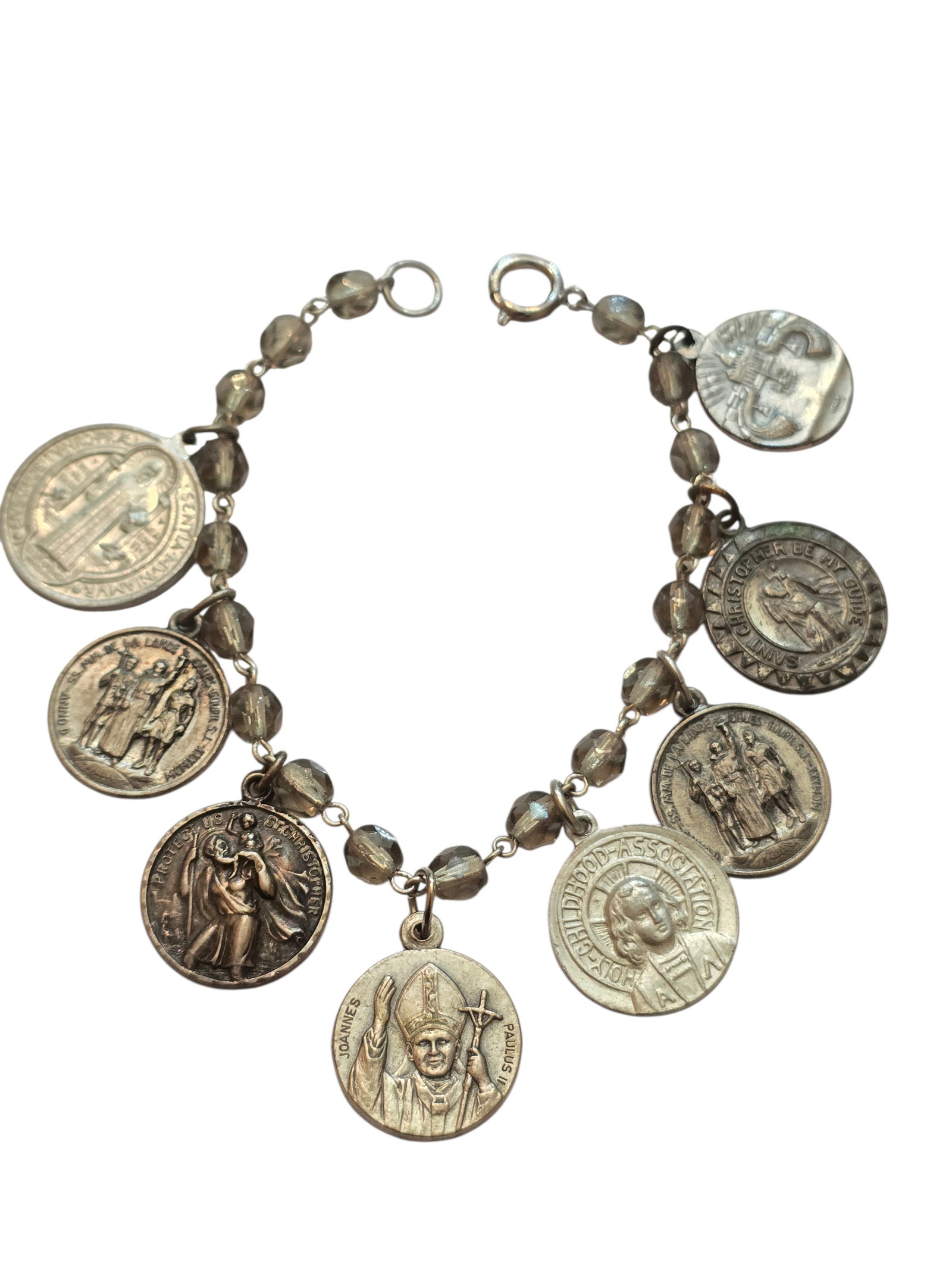 VINTAGE CRYSTAL AND RELIGIOUS ICON CHARM BRACELET: VINTAGE CRYSTAL AND RELIGIOUS ICON CHARM BRACELET. IN VERY GOOD CONDITION, MEASURES 7.75".