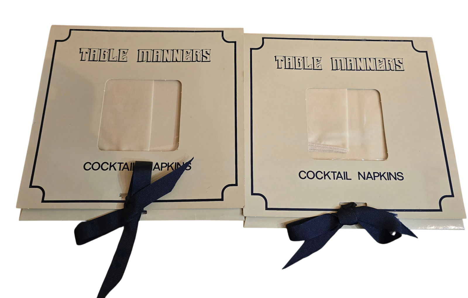 VINTAGE 2 SETS OF TABLE MANNERS COCKTAIL NAPKINS IN ORIGINAL CARD: VINTAGE 2 SETS OF TABLE MANNERS COCKTAIL NAPKINS IN ORIGINAL CARD. APPROX 6.5" SQUARE. IN VERY GOOD CONDITION, I BELIEVE THESE ARE SATIN. 6 IN EACH SET, ALTHOUGH WE ONLY DID UNTIE 1 SET. BEIGE COLOR.