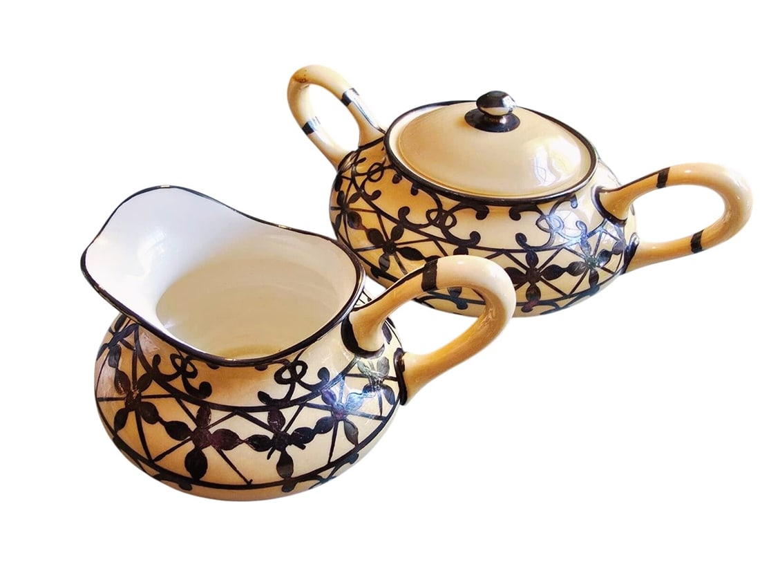 ANTIQUE LENOX IVORY PORCELAIN CREAM & SUGAR SET WITH SILVER OVERLAY: ANTIQUE LENOX IVORY PORCELAIN CREAM & SUGAR SET WITH SILVER OVERLAY . THIS VINTAGE LENOX CREAM AND SUGAR SET SHOWCASES EXQUISITE PORCELAIN WITH AN INTRICATE SILVER OVERLAY. IT EXUDES TIMELESS ELEGANCE