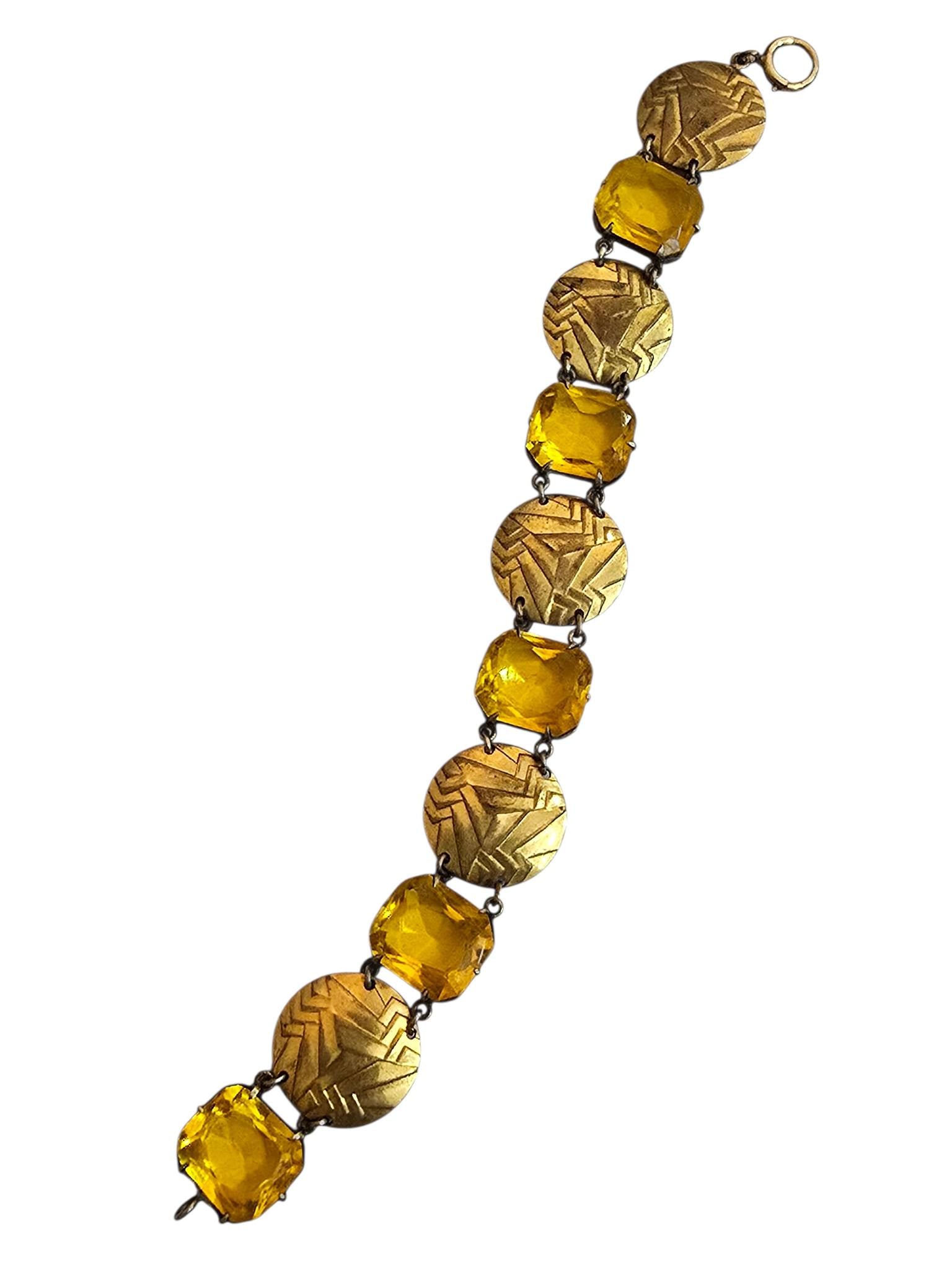 ANTIQUE CZECH GLASS AND BRASS DECO BRACELET: ANTIQUE CZECH GLASS AND BRASS DECO BRACELET. 7.5", PRONG SET STONES. SPRING RING LOOKS TO HAVE BEEN CHANGED, SOME WEAR TO THE BACK *RING BOX IS SOLD SEPARATELY *