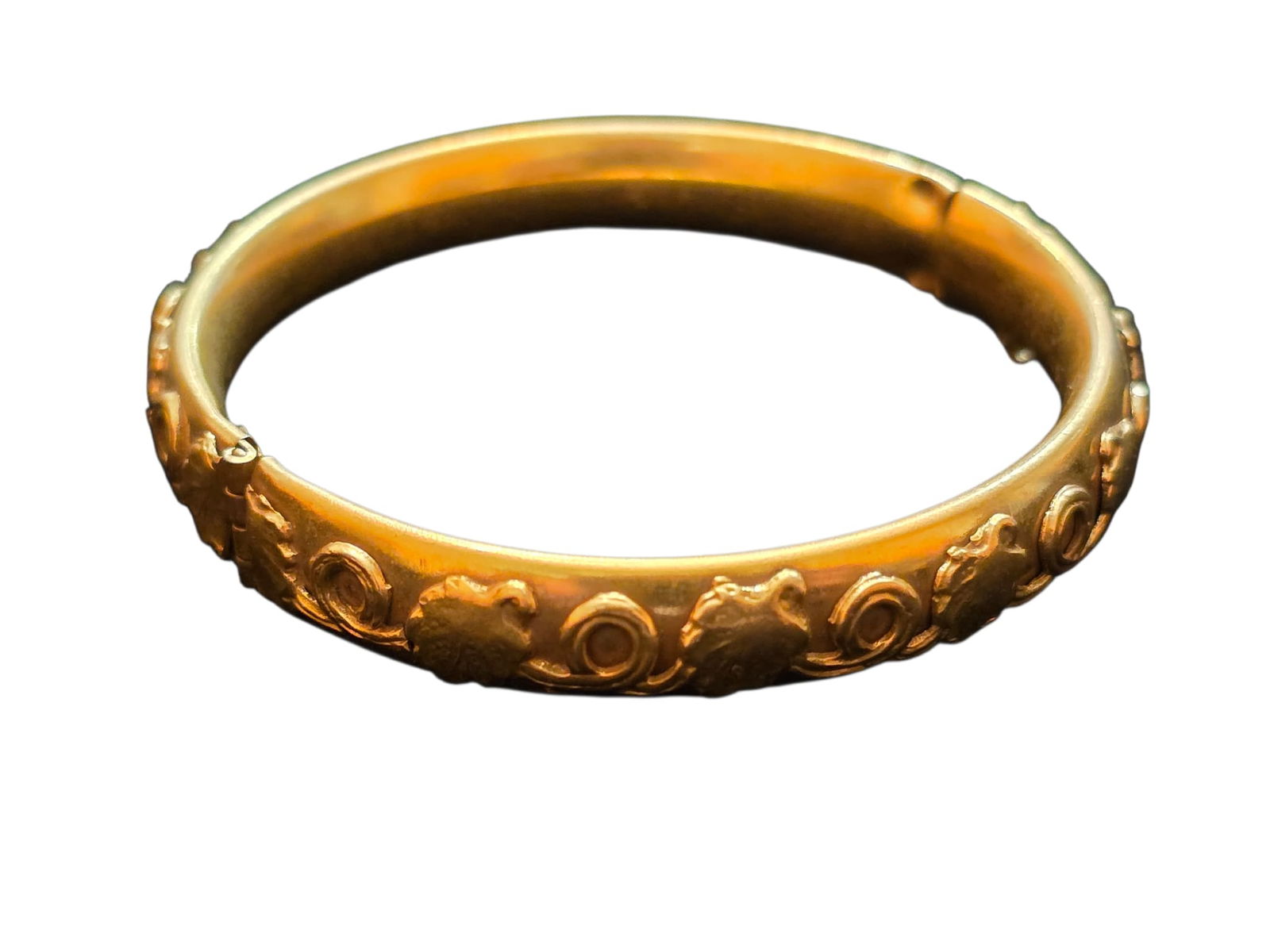 VINTAGE SIGNED SANDOR CO BRACELET: VINTAGE SIGNED SANDOR CO. ALL OVER DESIGN ON BRASS BRACELET, ID 2.75". MISSING SAFETY CHAIN