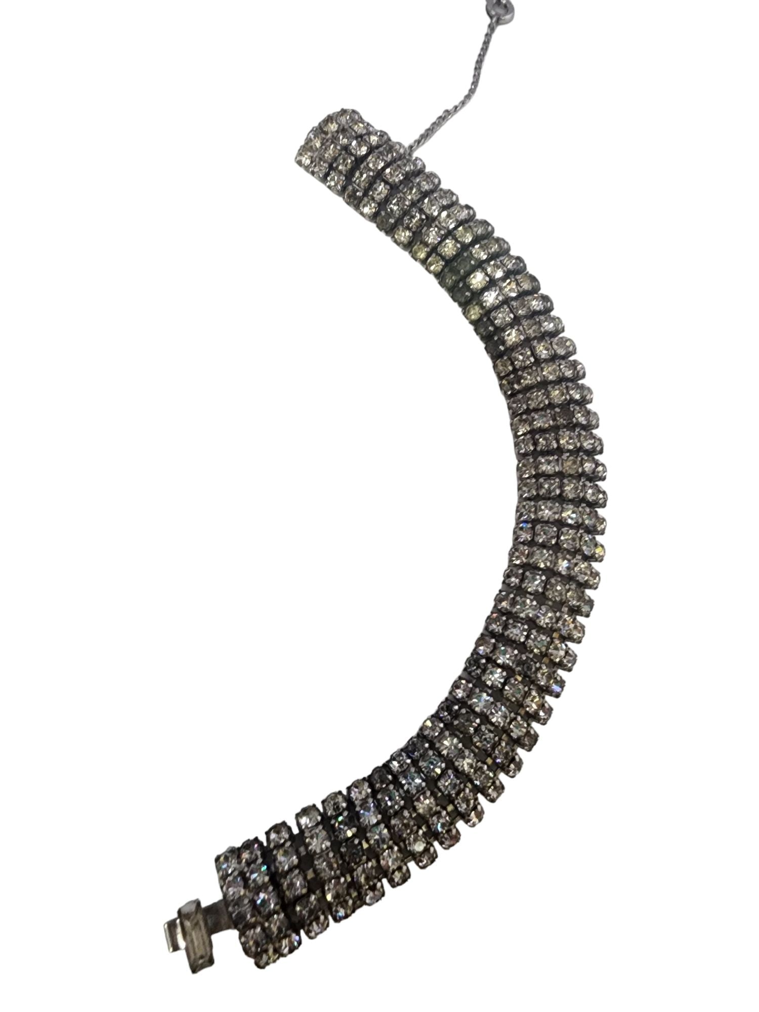 VINTAGE BLINGY RHINESTONE BRACELET WITH SAFETY CHAIN: Vintage Blingy Rhinestone Bracelet With Safety Chain. Approx. 7". In good condition, Some dark stones. Push-in clasp.