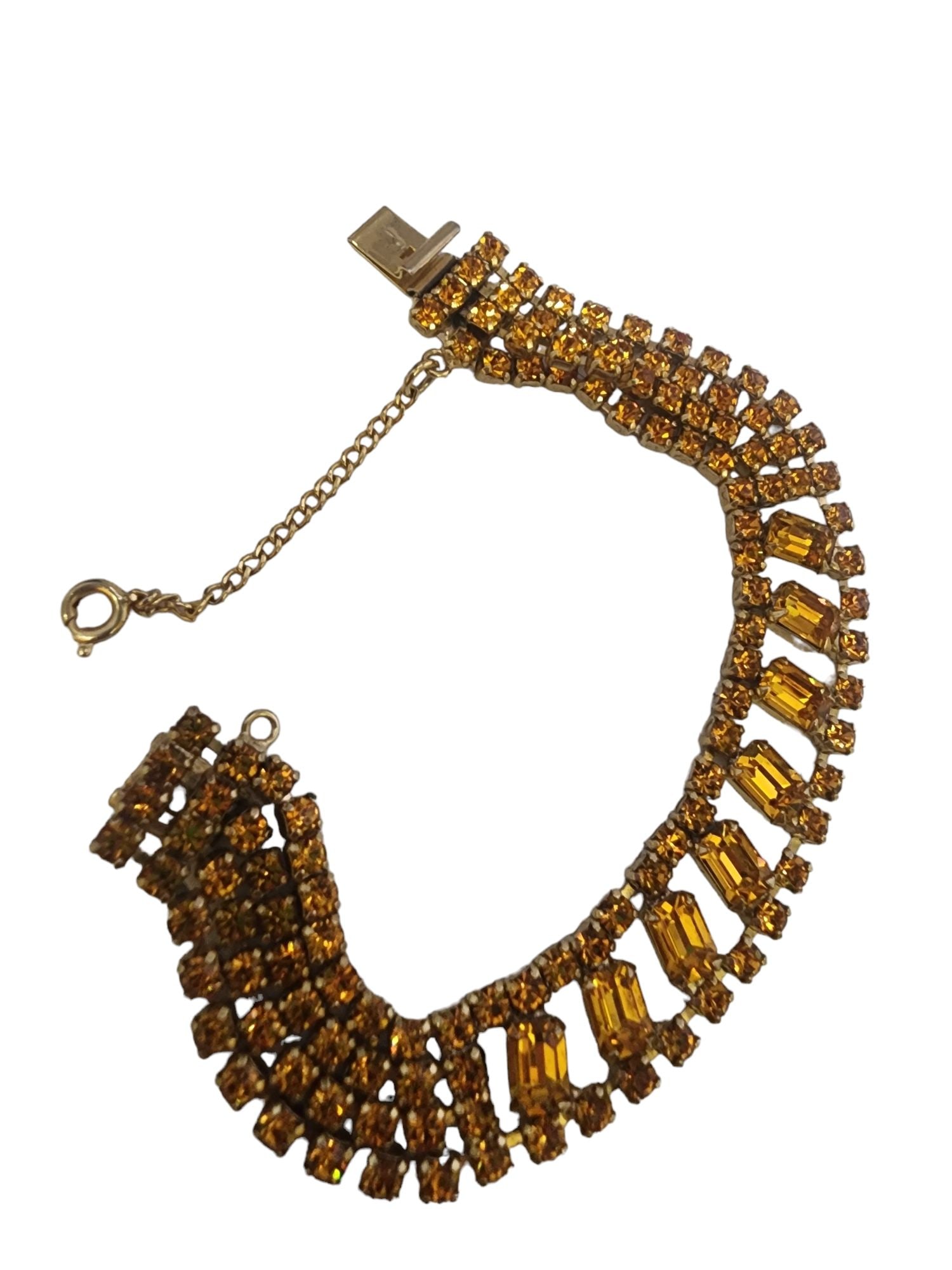 VINTAGE RHINESTONE BRACELET WITH PUSH-IN CLASP & SAFETY CHAIN: Vintage Rhinestone Bracelet With Push-In Clasp & Safety Chain. Approx 7.25". With push-in clasp and safety chain