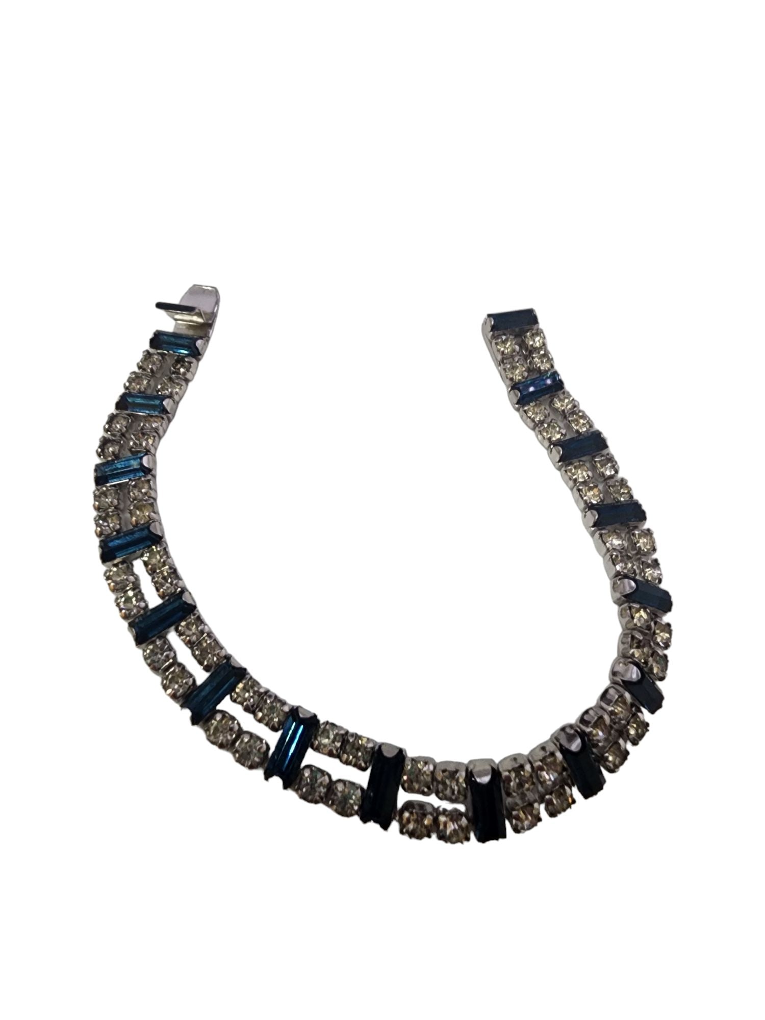 VINTAGE ROYAL BLUE & CLEAR RHINESTONE BRACELET RHODIUM-PLATED PUSH-IN CLASP.: Vintage Royal Blue & Clear Rhinestone Bracelet Rhodium-Plated Push-In Clasp. Approx. 6.75". This vintage bracelet features shimmering clear rhinestones paired with royal blue baguette stones, set in r