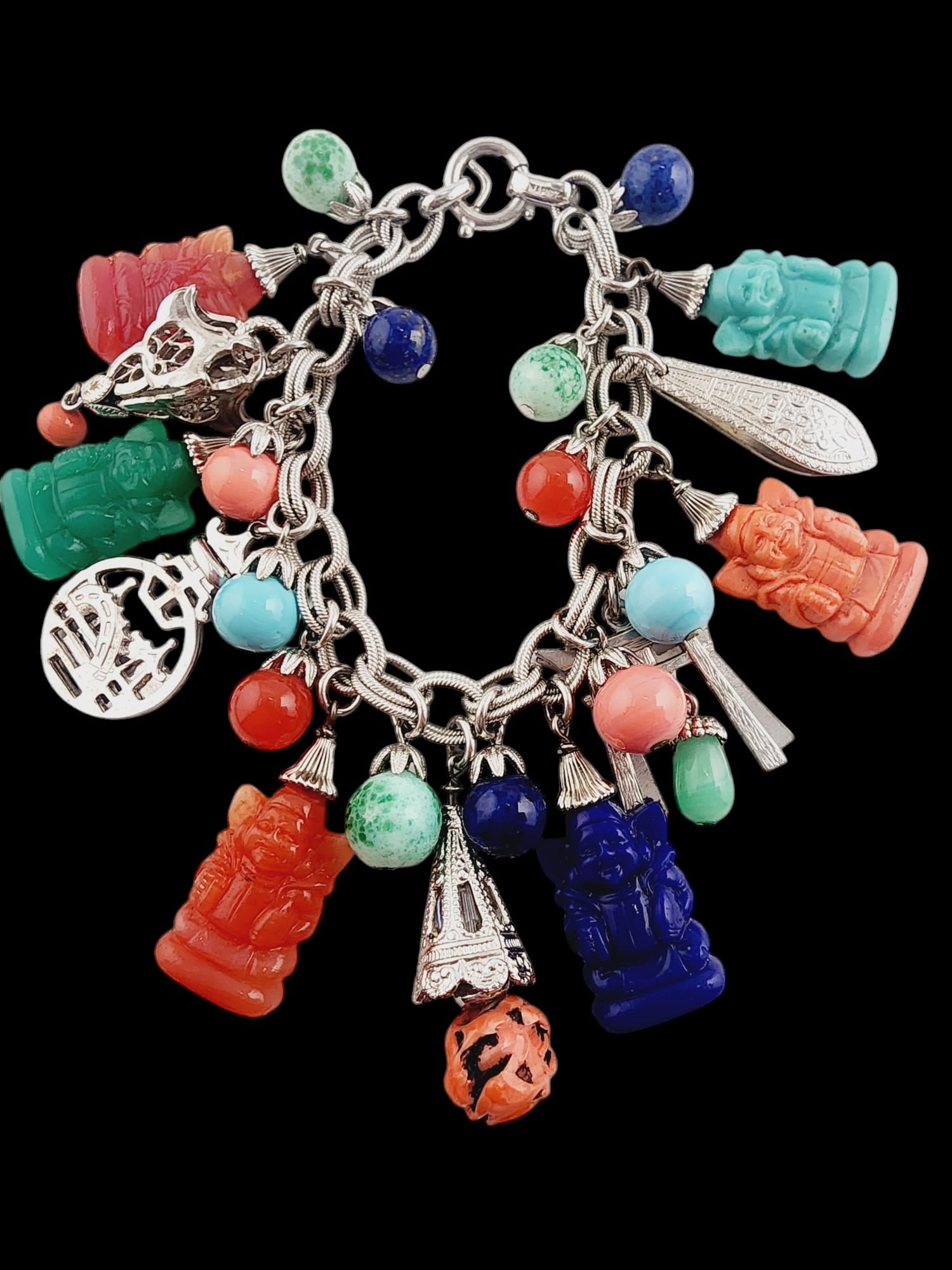 ASIAN MOTIFF HARD TO FIND SIGNED NAPIER GLASS CHARM BRACELET: Asian Motiff Hard to Find Signed Napier Glass Charm Bracelet. Not so easy to find, this one has been stored away about 15 years, in my collection. In absolutely pristine condition. Plating is amazing,