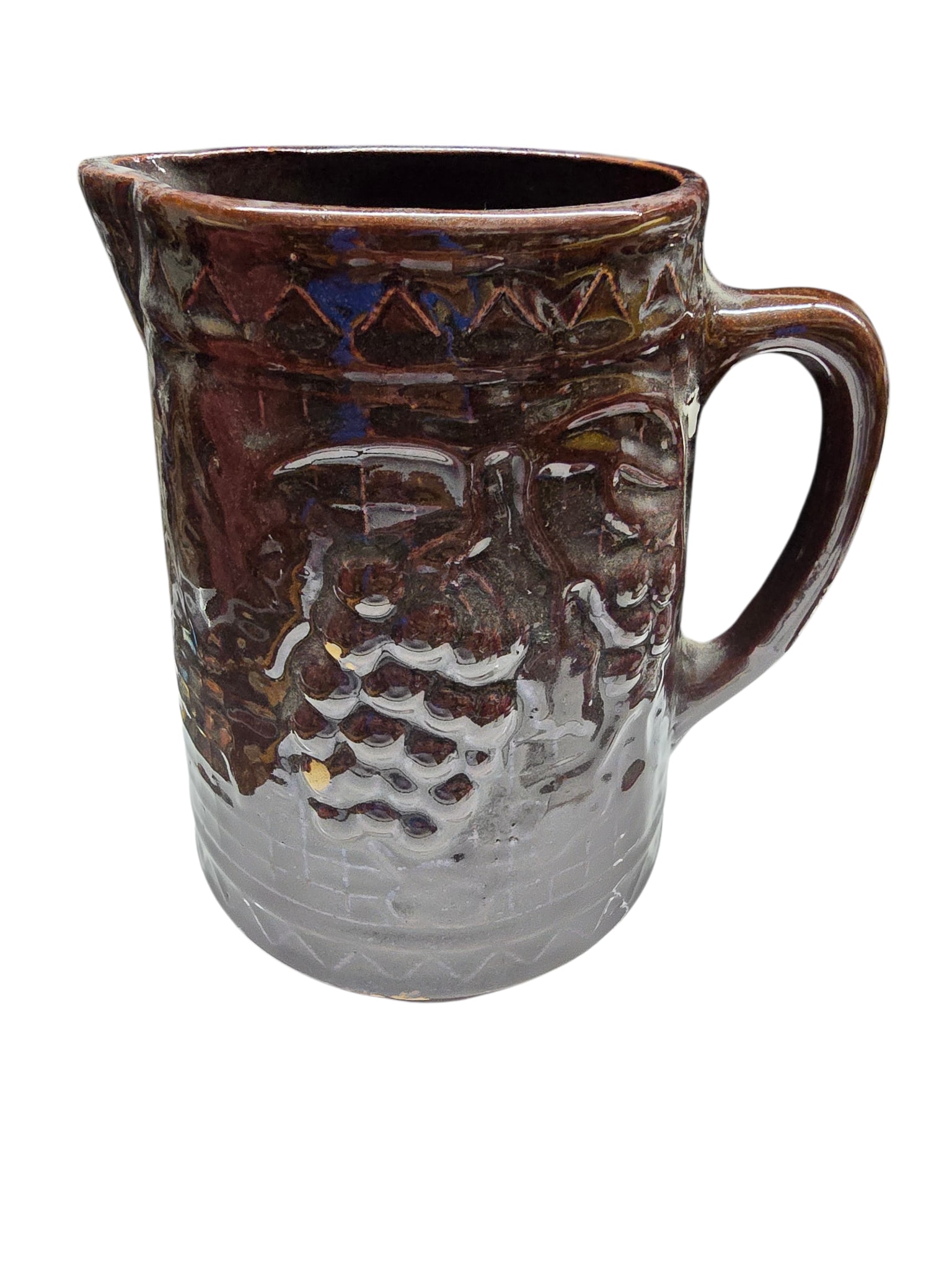 ANTIQUE NORTHSTAR STONEWARE GRAPES RICK/RACK BROWN GLAZE PITCHER: ANTIQUE NORTHSTAR STONEWARE GRAPES RICK/RACK BROWN GLAZE PITCHER. APPROX 8" x 7" TO END OF TOP. 3 DIMENSIONAL, SOME MARKS WHERE GLAZE IS OFF. IT HAS A MARK AT THE BOTTOM.