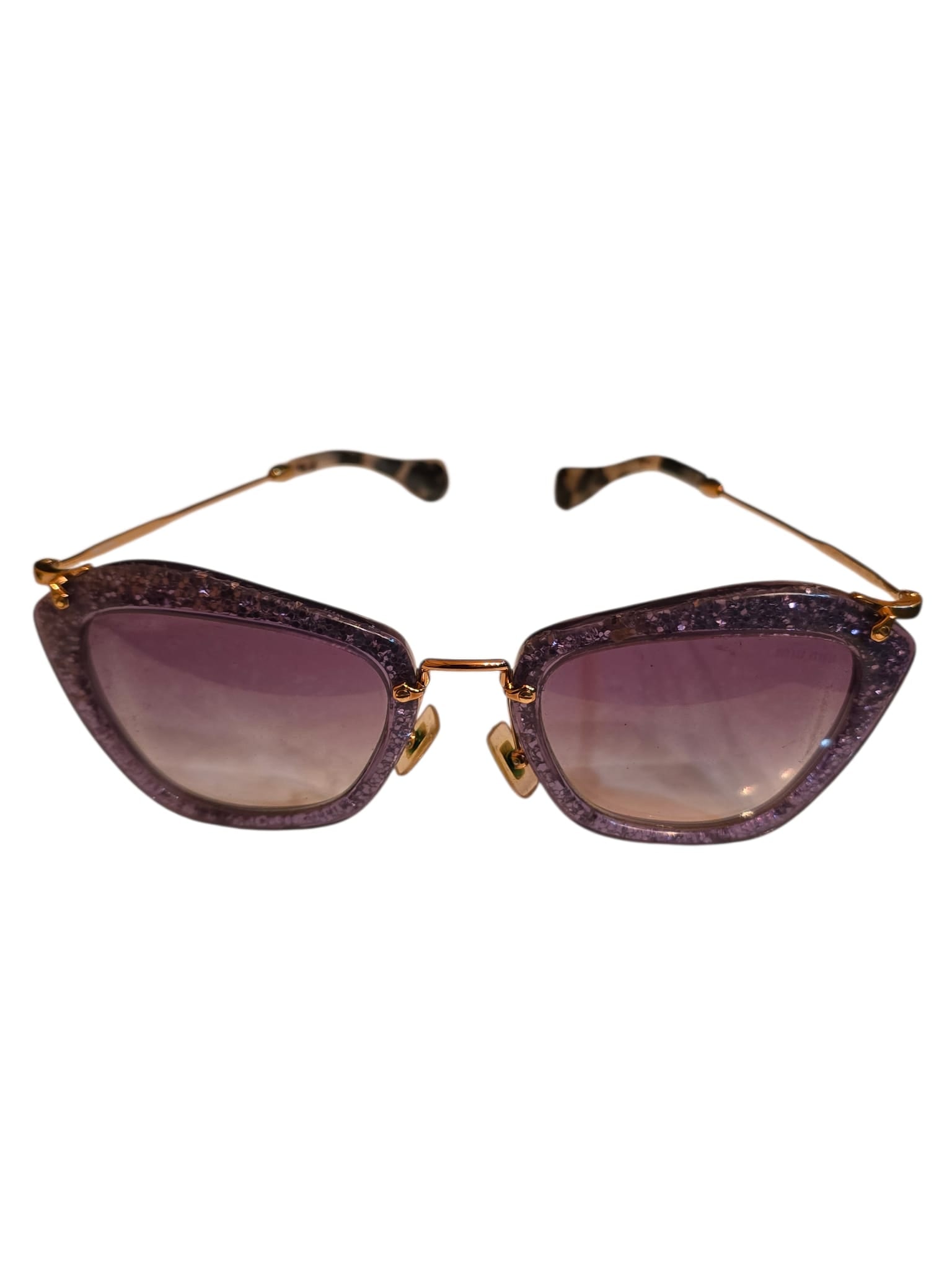 VINTAGE SIGNED MIU MIU PURPLE GLITTER SUNGLASSES: VINTAGE SIGNED MIU MIU PURPLE GLITTER SUNGLASSES. LENSE ARE NOT 100% CLEAR. SOME LIGHT LINES AND MARKS. METAL BEFORE BROWN BACK PART OF ARMS MOVES. AS WELL AS BACK BROWN PART OF ARMS.