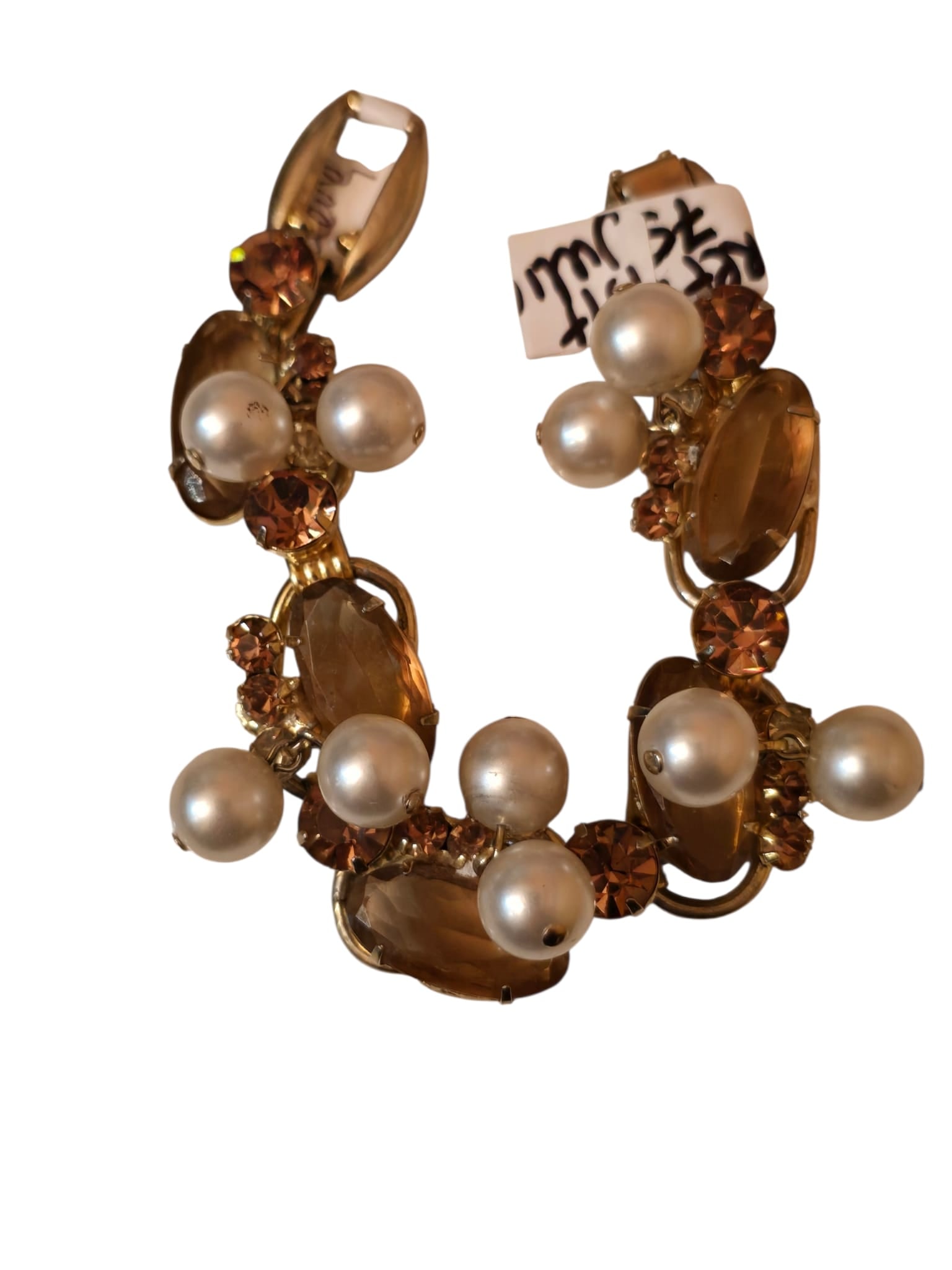 BROWN RHINESTONE AND PEARL CHACHA VERIFIED JULIANA BRACELET: BROWN RHINESTONE AND PEARL CHACHA VERIFIED JULIANA BRACELET. GOES TO ALMOST 7.25" NO SAFETY CHAIN, IN THE IS IT JULIANA 7582